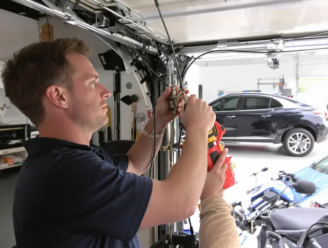 West Covina Garage Door Repair safety certified technician performing cable replacement in West Covina