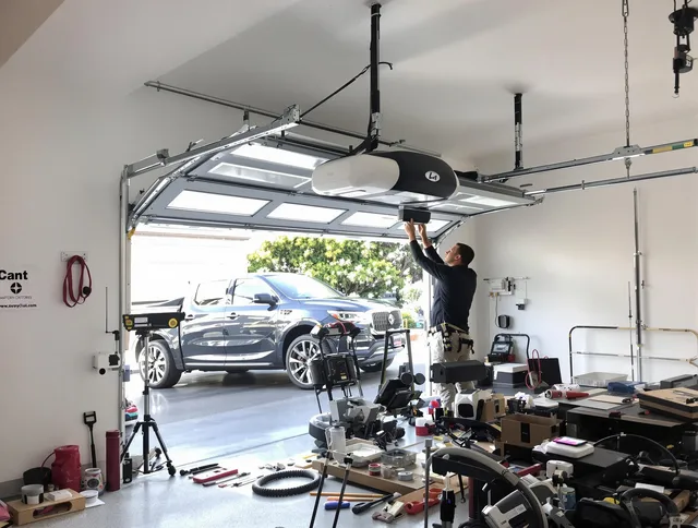 West Covina Garage Door Repair specialist installing smart garage door opener system in West Covina home